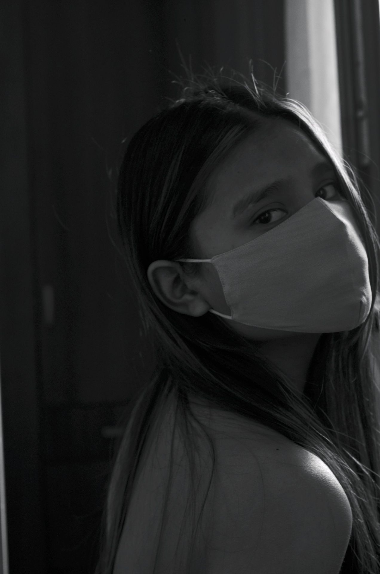 woman wearing white face mask